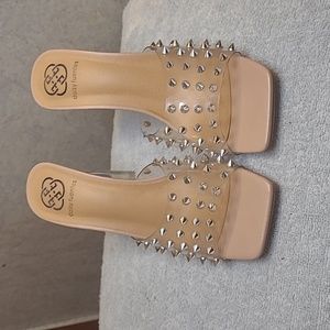 Cinderella clear/silver spiked heels.
